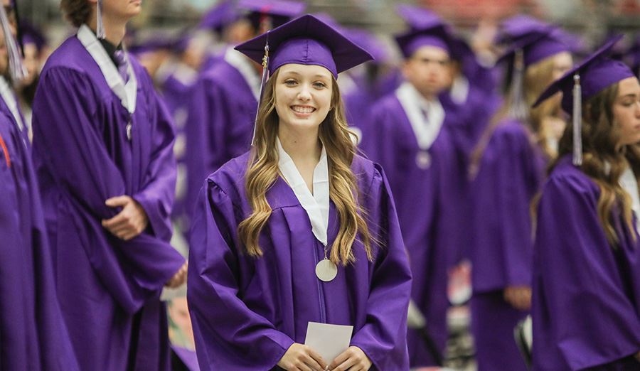  Female Sunrise Mountain graduate smiles at the camera