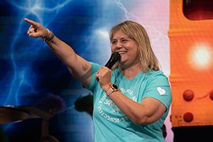 Becky Berhow celebrates on stage