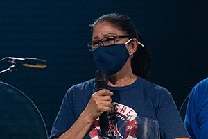 Candelaria celebrates on stage after winning award