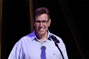 Jim Myers speaks after winning award