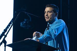 Sammy Chagolla at podium accepting award