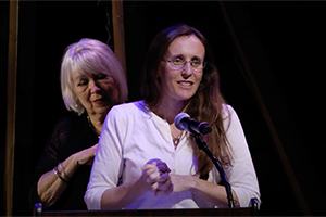 Sandra Schossow accepting award at podium